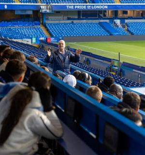 a man standing in the stands at a baseball game