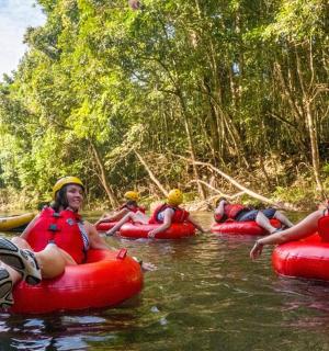 a group of people are rafting on a river