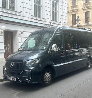 a black van is parked on a city street