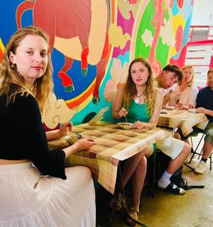 a group of people sitting at tables in a room
