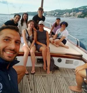 a group of people sitting on a boat