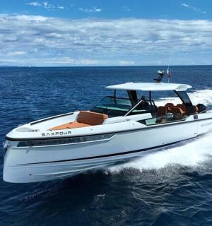 a white boat in the water on the ocean