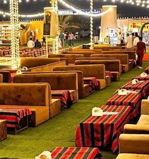 a row of couches in a room with lights