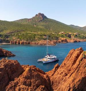a boat in a body of water with mountains
