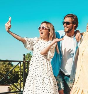 a group of three people posing for a picture