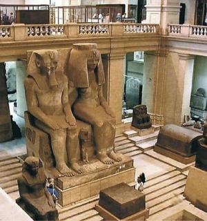 a museum with a statue in the middle of a building