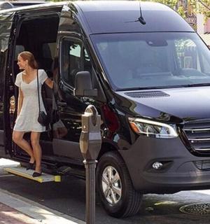 a woman is stepping out of a van