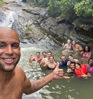a man standing in the water with a group of people