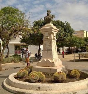 a statue of a man on top of a monument