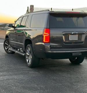 a black suv parked in a parking lot