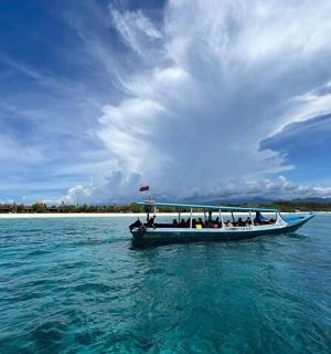 a group of people on a boat in the water