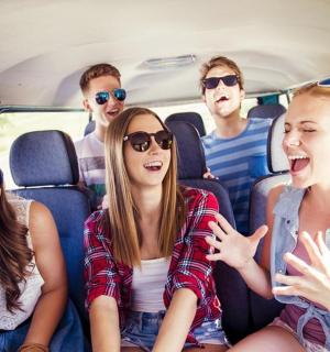 a group of people sitting in the back of a van