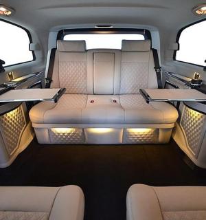 an inside view of a van with two tables