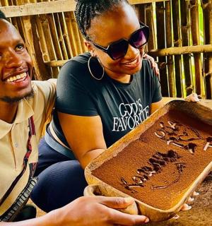 a man and a woman holding a piece of cake