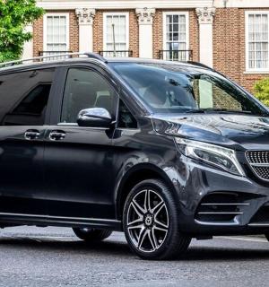 a black mercedes benz suv parked on a street