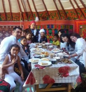 a group of people sitting around a dinner table