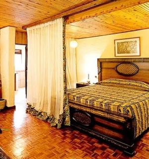 a bedroom with a large bed in a room
