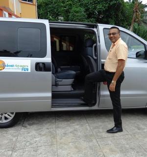a man standing in the door of a van
