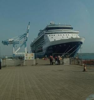 a large cruise ship is docked at a dock