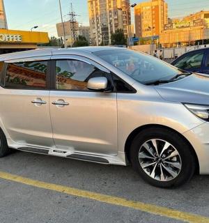 a silver car parked in a parking lot