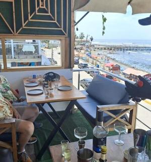 a man is giving a woman a glass of wine