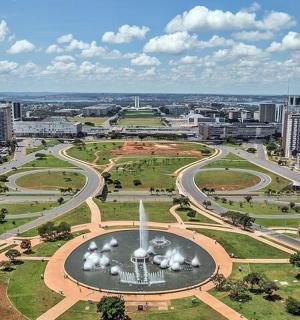 an aerial view of a city with a fountain