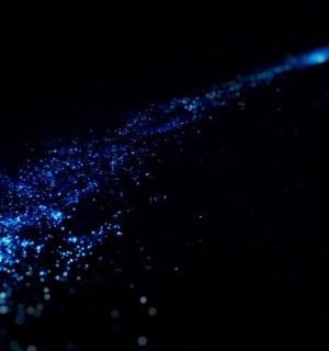 a pile of blue particles in the dark