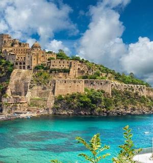 a castle on top of an island in the ocean