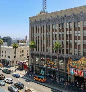 an aerial view of a busy city street with cars