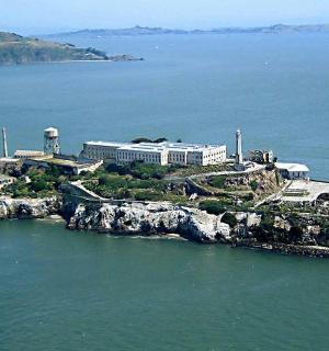 an island in the water with a building on it