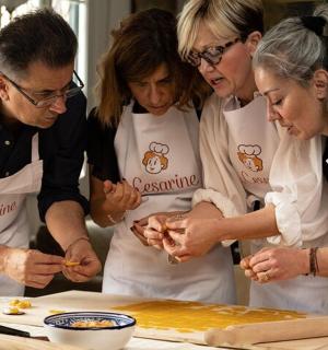 a group of people in a kitchen preparing food