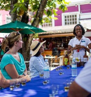 a group of people sitting around a table with wine glasses
