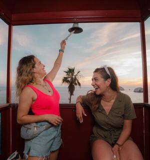 two women are sitting on a boat
