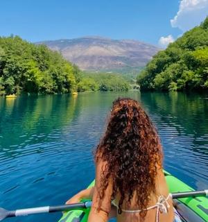 a woman in a boat on a river