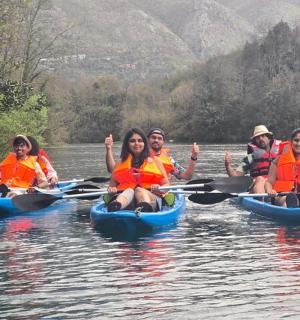 a group of people in kayaks on a river