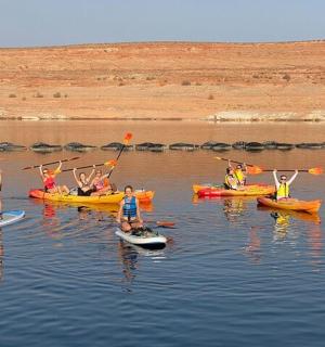 a group of people in kayaks in the water