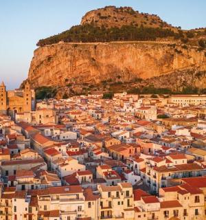 a view of a city with a mountain in the background