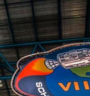 a bucket and a sign with a world on it