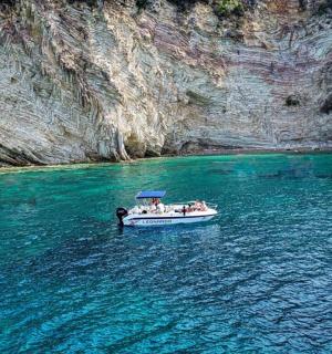 a group of people on a boat in the water