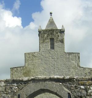 a church steeple with a cross on top of it