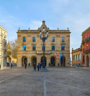 a group of people walking in front of a building