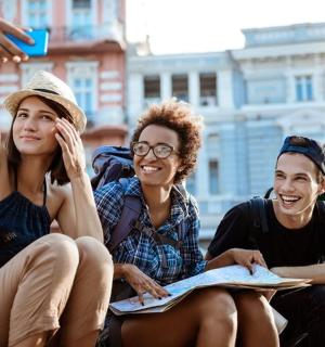 a group of three people sitting next to each other