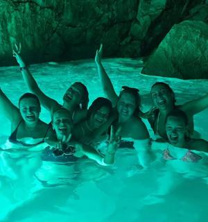 a group of people swimming in the water