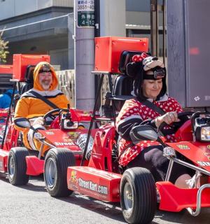 a group of people riding in a group of cars