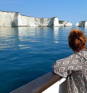 a woman on a boat looking out over the water
