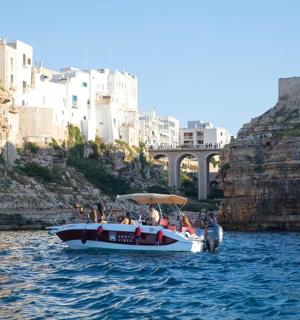 a group of people on a boat in the water