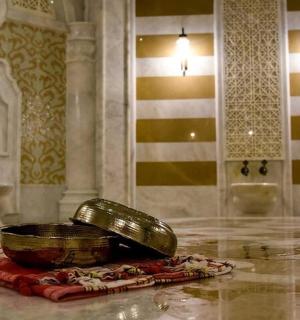 a room with a bowl on the floor in a room with a flag