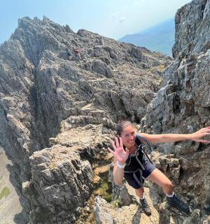 a man is climbing on a rocky mountain