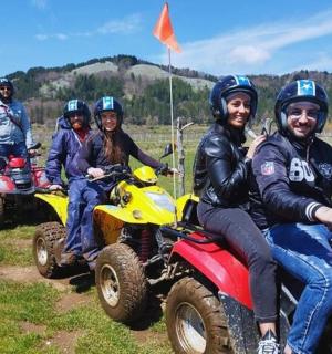 a group of people riding on atvs in a field