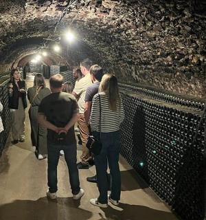 a group of people standing in a tunnel